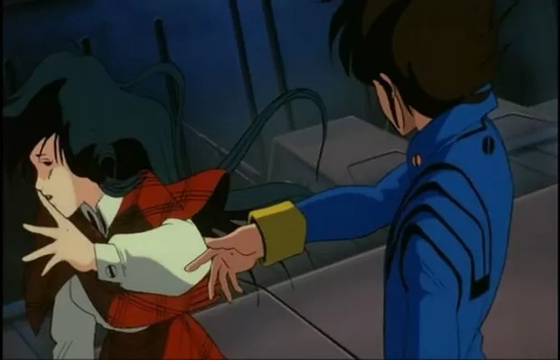 Hiraku, visto aqui estimulando uma atuação mais madura de Minmay, no método Hank Pym.