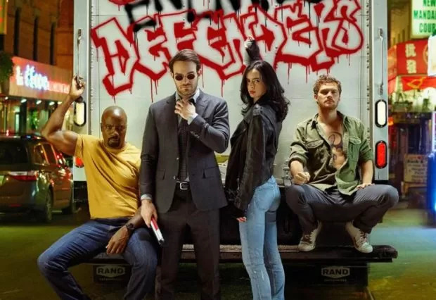 The Defenders, Mike Colter as Luke Cage, Charlie Cox as Daredevil, Krysten Ritter as Jessica Jones, and Finn Jones as Iron Fist, photographed for Entertainment Weekly on December 10th, 2016, by Finlay Mackay in Brooklyn, New York. Costume Designer: Stephanie Maslansky, Wardrobe Supervisor: Pahelle Latino, Makeup Head: Sarit Klein, Key Makeup Artist: Kaela Dobson, Hair Department Head: Pamela May, FX Makeup: Brian Spears, Prop Stylist: Charlot Malmlof